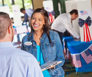 election poll worker wearing white oval name badge